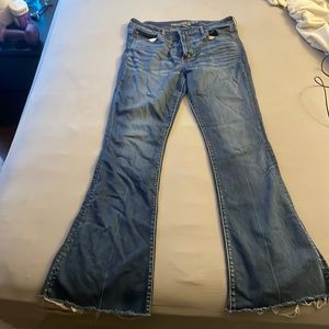 American eagle flared jeans with frayed bottom trim.